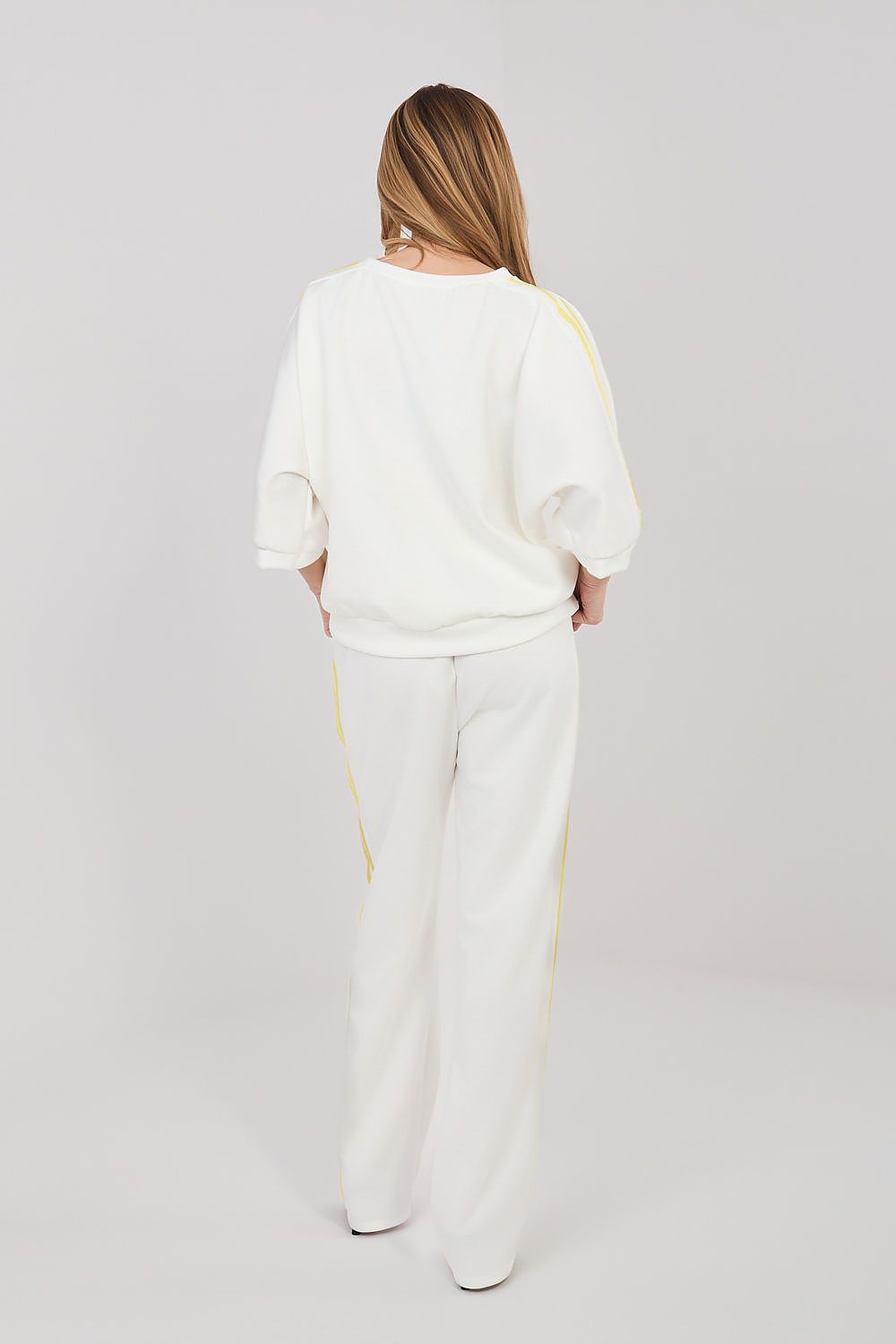 Cream lounge set with yellow stripe accents, relaxed top and wide-leg pants