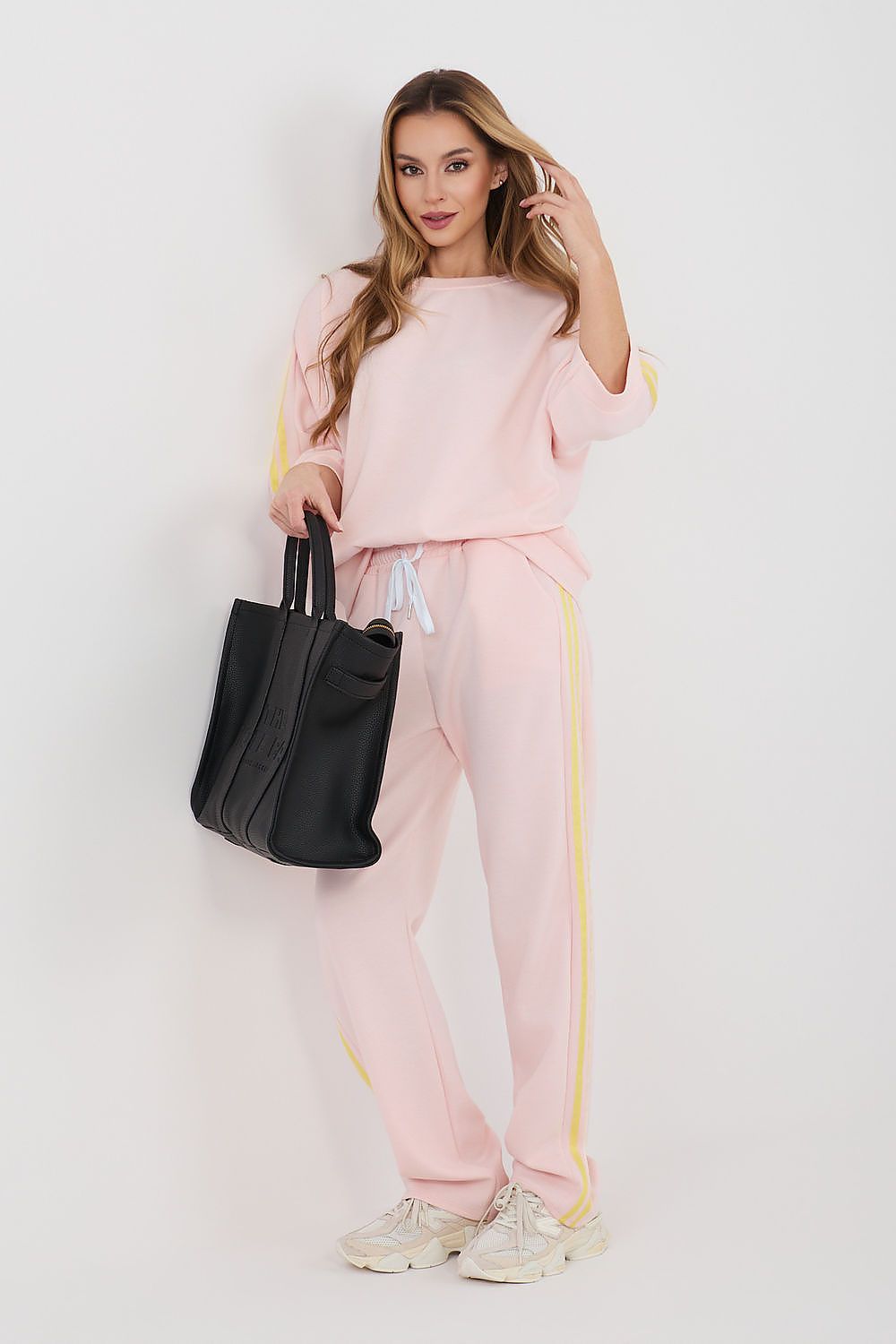 Pink two-piece tracksuit set: sweatshirt top with yellow piping and jogger pants