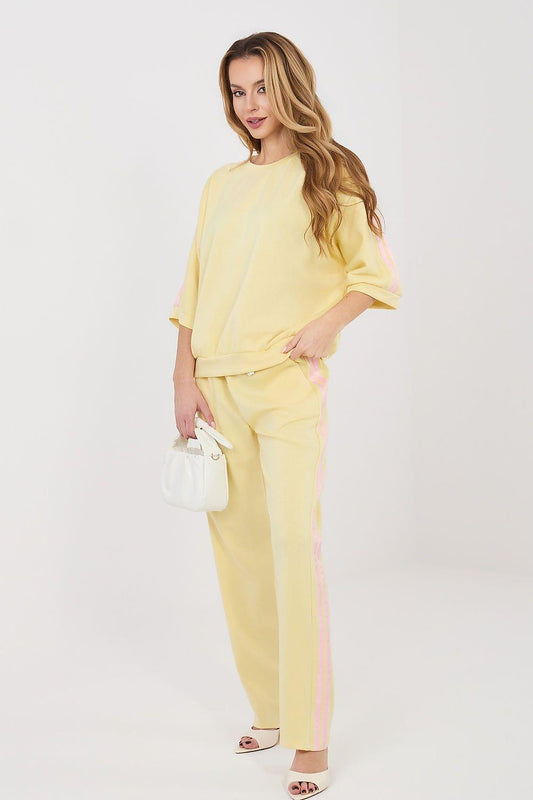 Yellow two-piece set with draped elbow-length blouse and matching straight pants