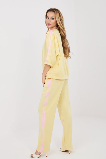 Yellow coordinated blouse and wide-leg pants, relaxed fit with dropped shoulders