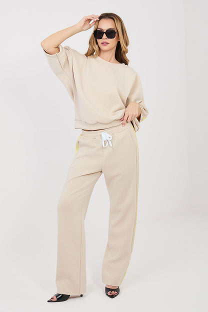 Beige lounge set with long-sleeve sweatshirt and drawstring track pants with bow