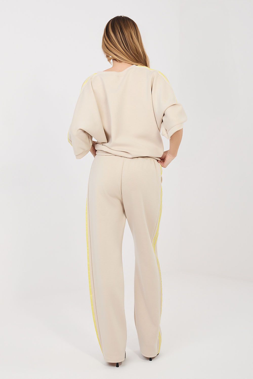 Beige back view lounge set: sweatshirt and wide-leg track pants with yellow stripe