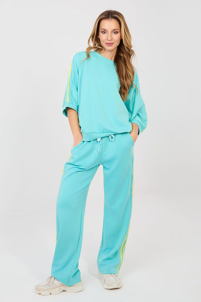 Turquoise two-piece lounge set with drawstring waist jogger pants and matching sweatshirt