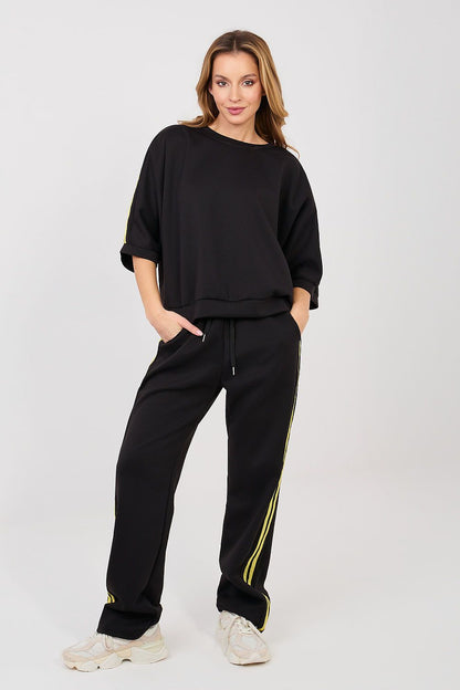 Black tracksuit set with neon yellow side stripes, loose sweatshirt and jogger pants