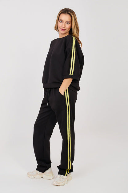 Black tracksuit set with neon yellow side stripes, quarter sleeve sweatshirt and joggers