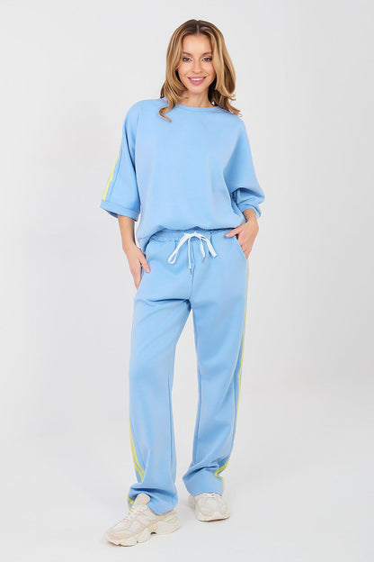 Light blue lounge set with crew sweatshirt and drawstring jogger pants, yellow side stripes