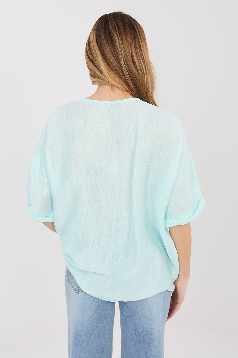 Light blue short-sleeve button shirt, back view with gathered cuffs