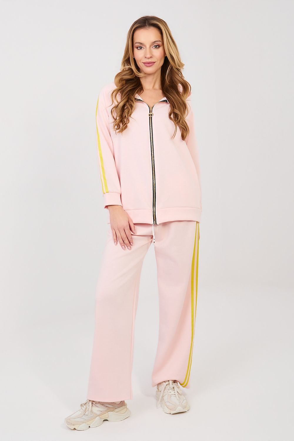 Pink zip-front hoodie with yellow trim and wide-leg pants, matching tracksuit set
