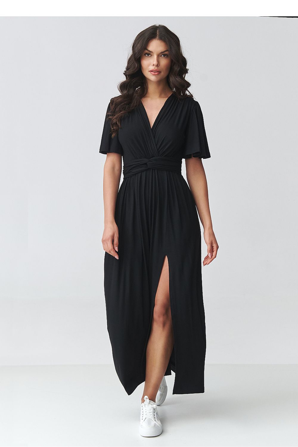 Black v-neck daydress with short flutter sleeves, waist tie, and side slit at hem