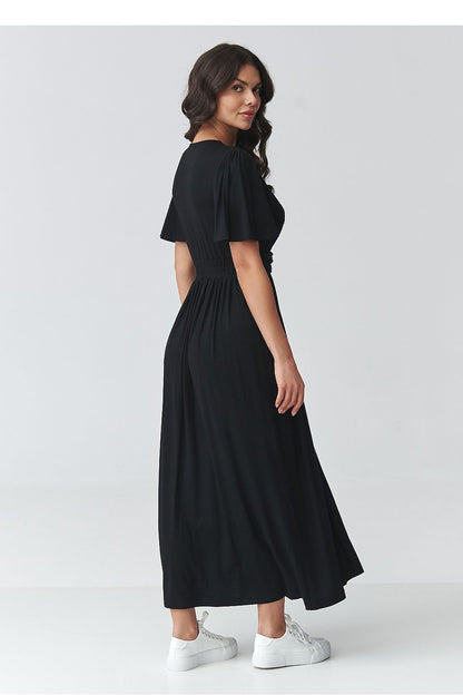 Black daydress back view with short flutter sleeves and gathered waist, long skirt