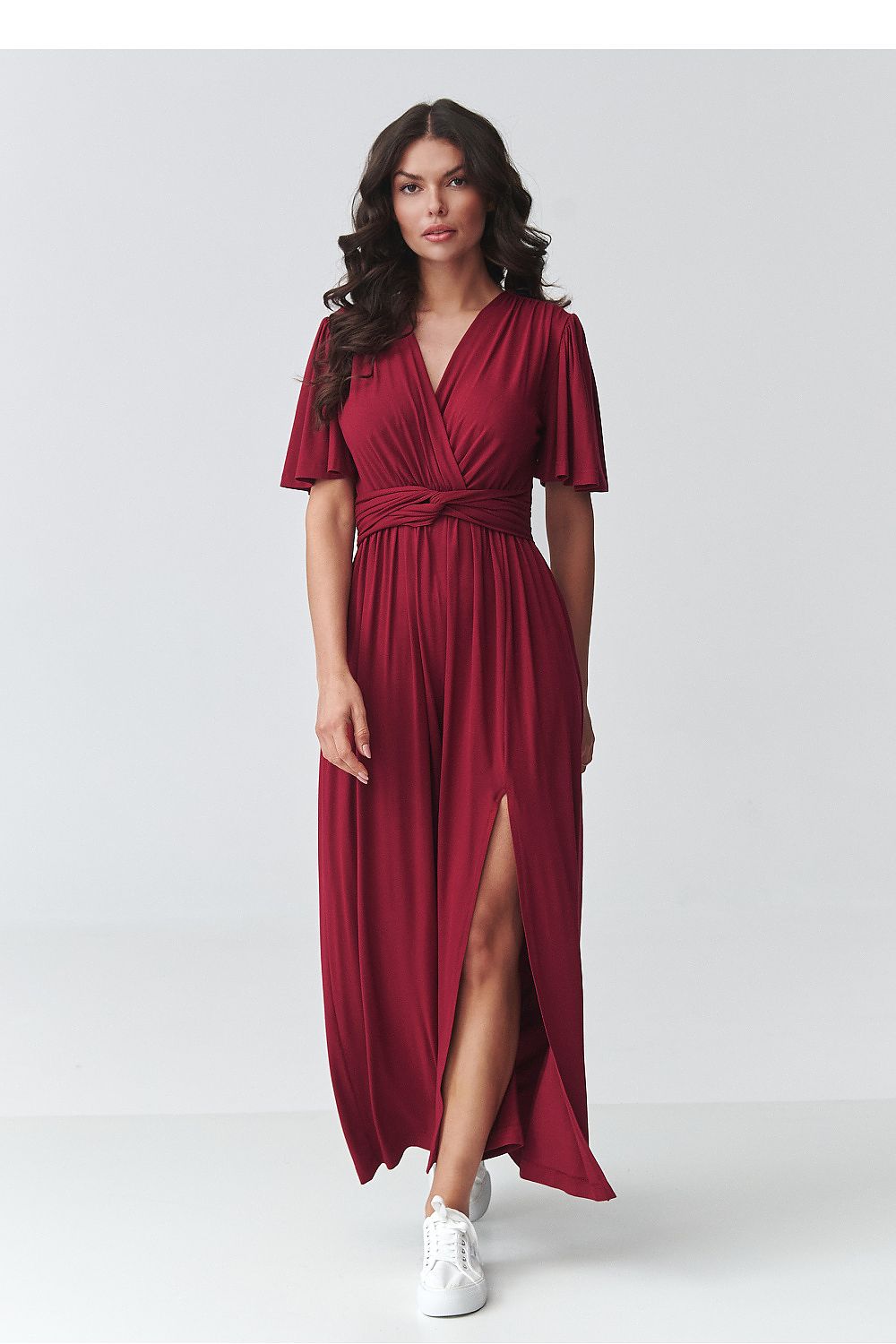 Red v-neck daydress with short flutter sleeves, waist tie, and side slit at hem