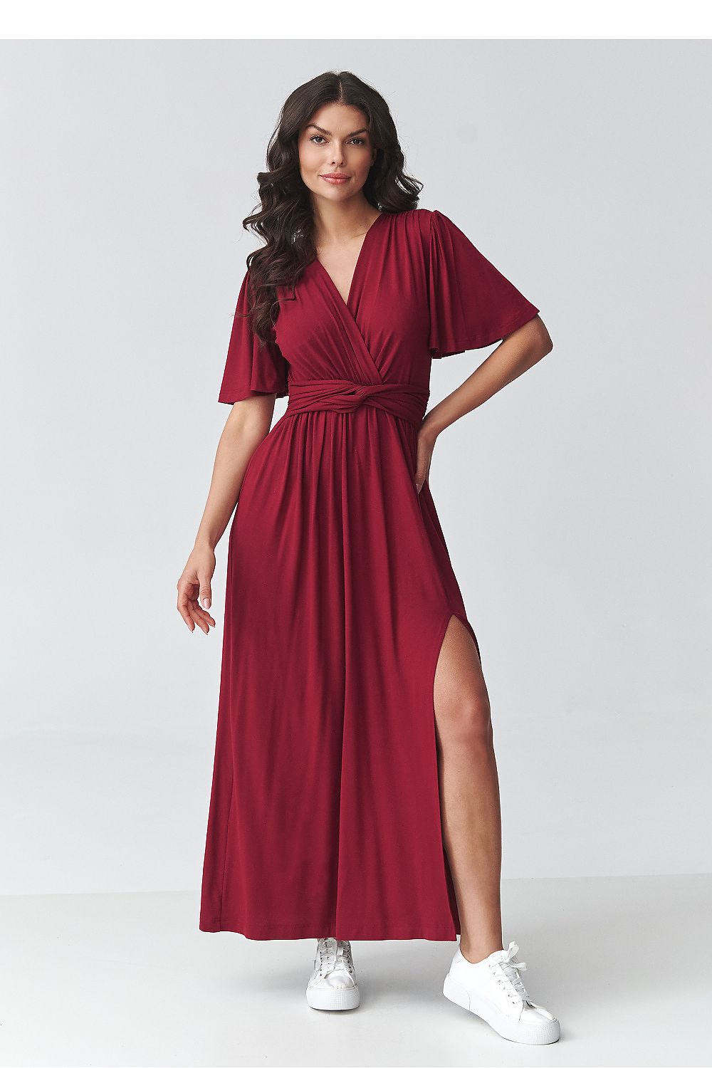 Red daydress with v-neck, short flutter sleeves, belted waist, and side slit at hem