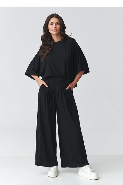 Black two-piece outfit set with loose batwing top and relaxed wide-leg pants