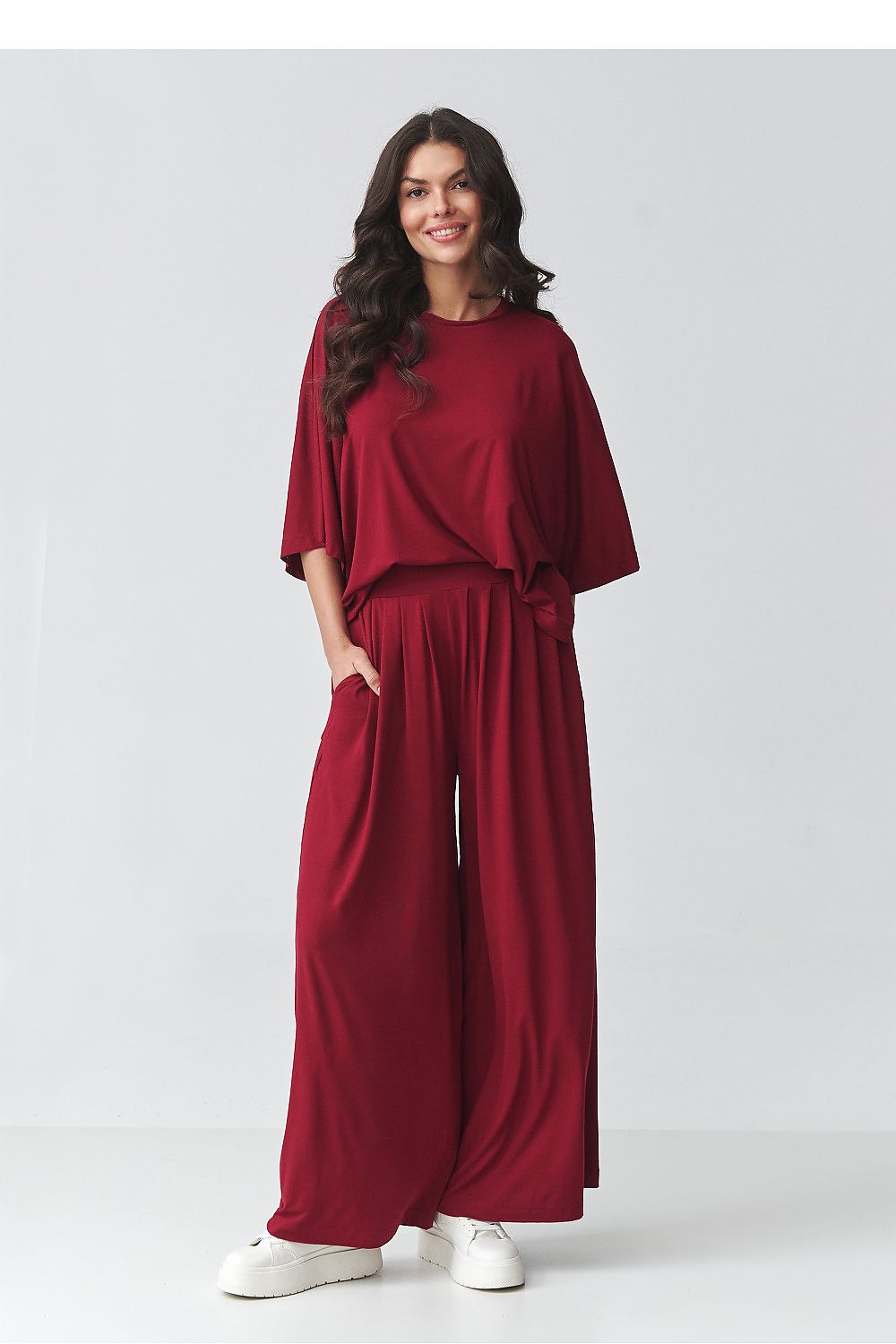 Red two-piece outfit set with loose batwing top and relaxed wide-leg pants
