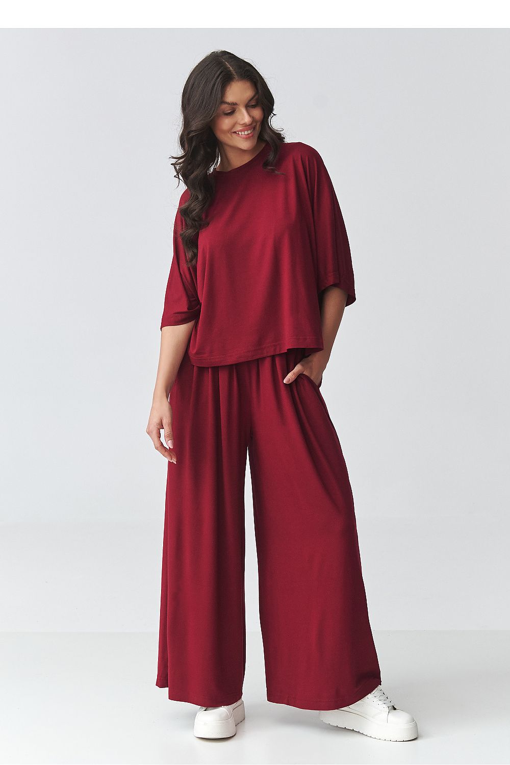 Red draped top and wide-leg pants set with cuffed sleeves and elastic waist