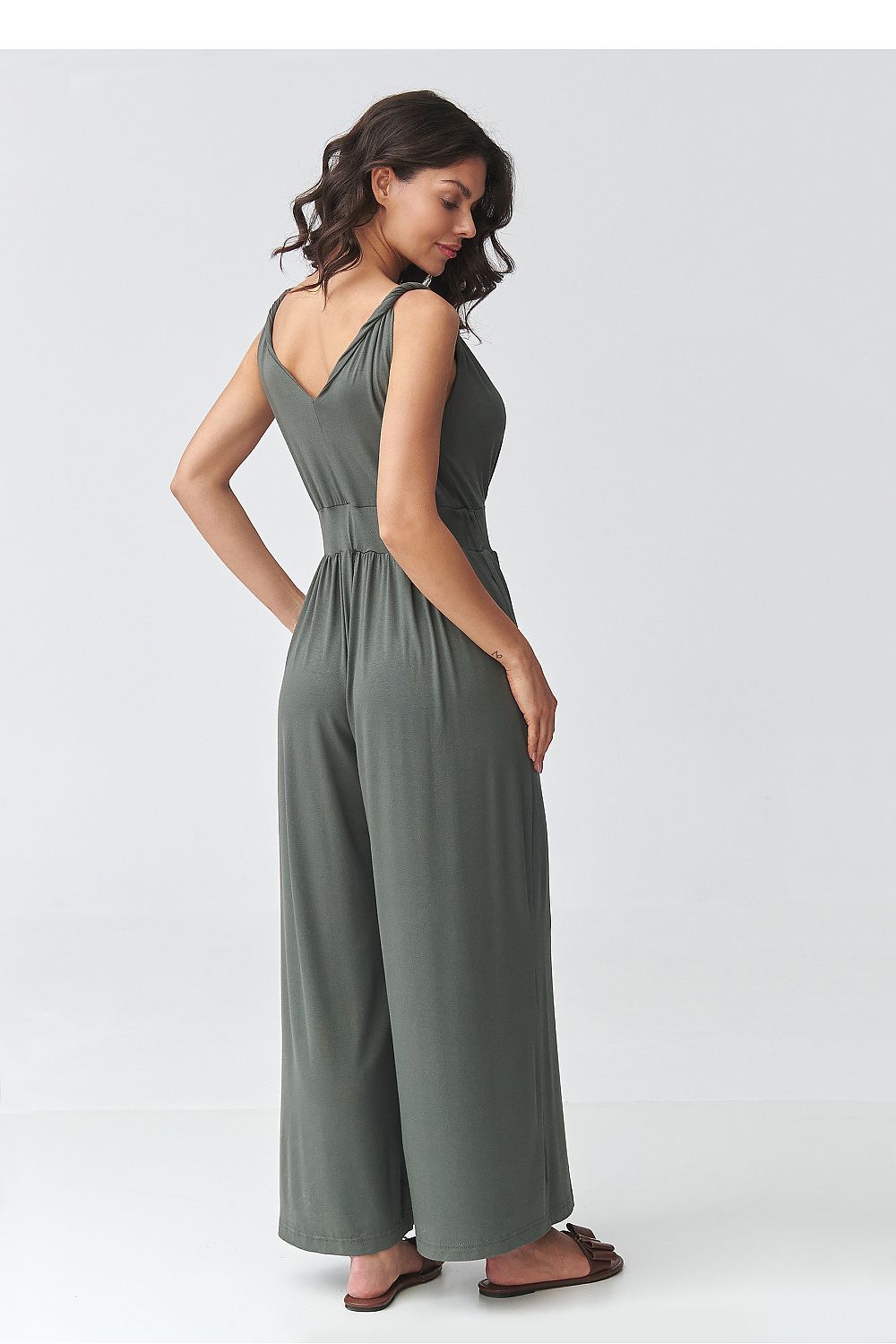 Olive green sleeveless V-neck wide-leg jumpsuit with gathered waist, side view