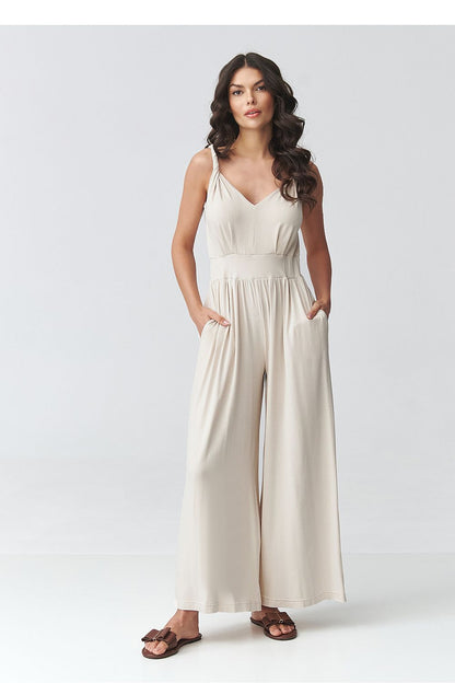 Light beige sleeveless V-neck wide-leg jumpsuit with gathered waist, full length