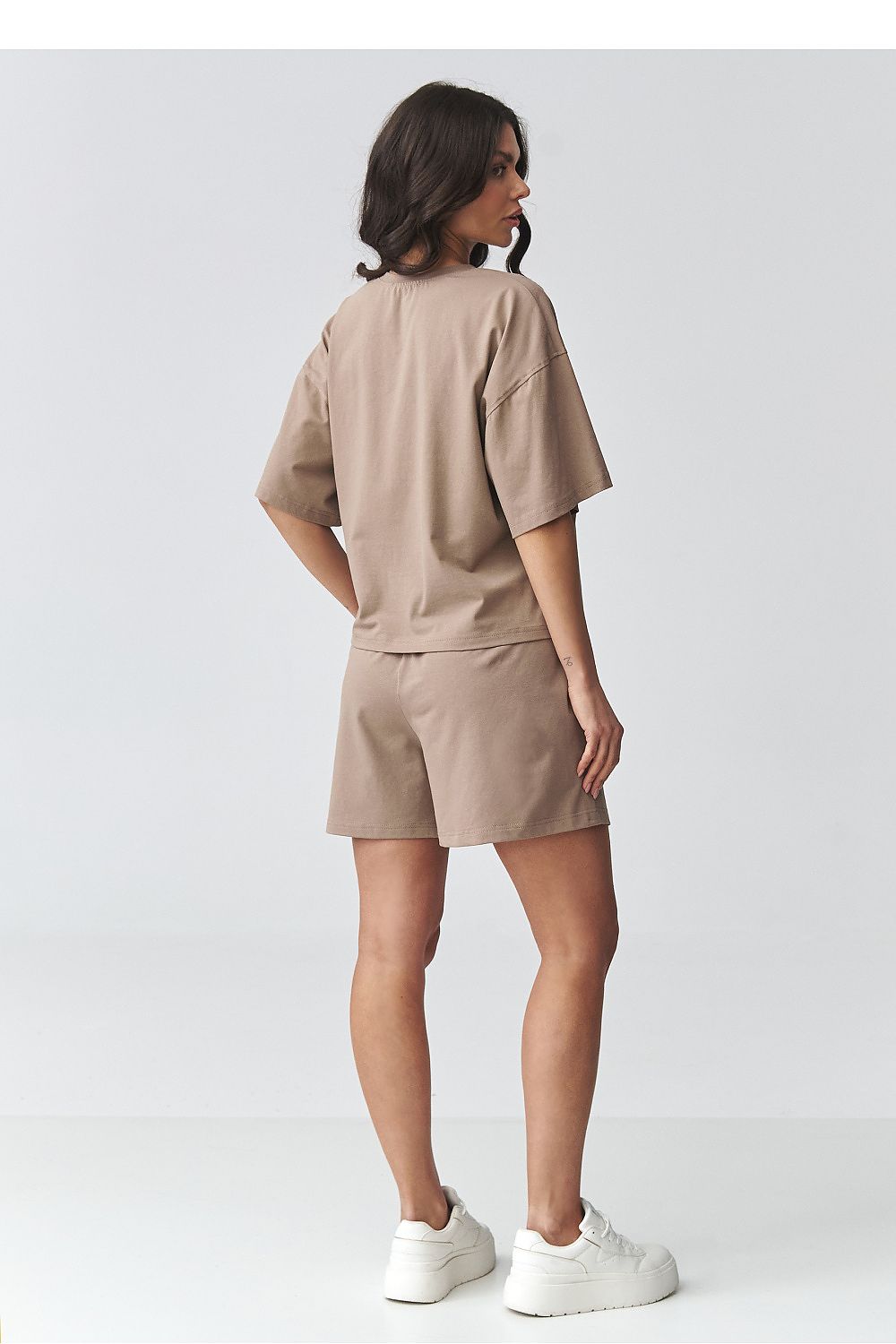 Light brown two-piece short set, back view: oversized T-shirt and elastic waist shorts