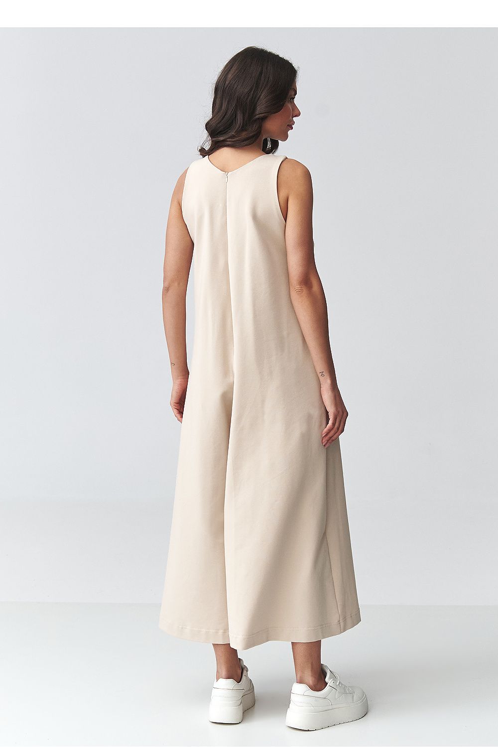 Beige sleeveless wide-leg jumpsuit, back view with rounded neckline and long hem
