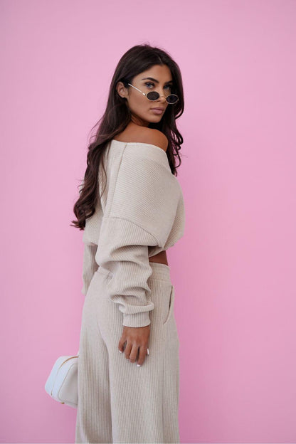 Light beige off-shoulder knit cardigan with matching wide-leg pants set