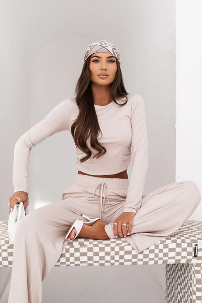 Beige two-piece lounge set with long-sleeve top and drawstring waist wide-leg trousers