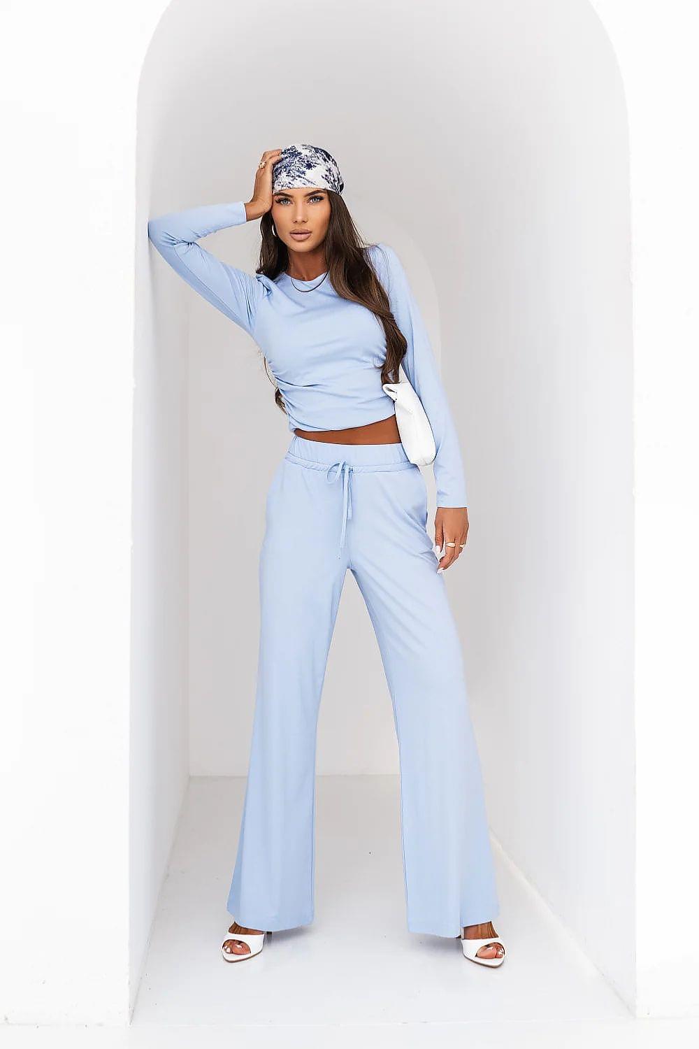 Light blue two-piece lounge set with long-sleeve top and drawstring waist wide-leg pants