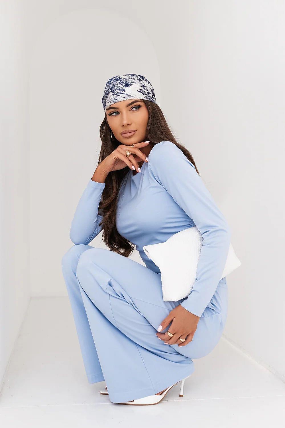Light blue two-piece lounge set with long-sleeve top and drawstring waist wide-leg trousers