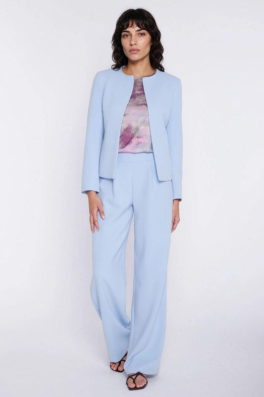 Women’s light blue wide-leg trousers with high waist and wide, straight hems.