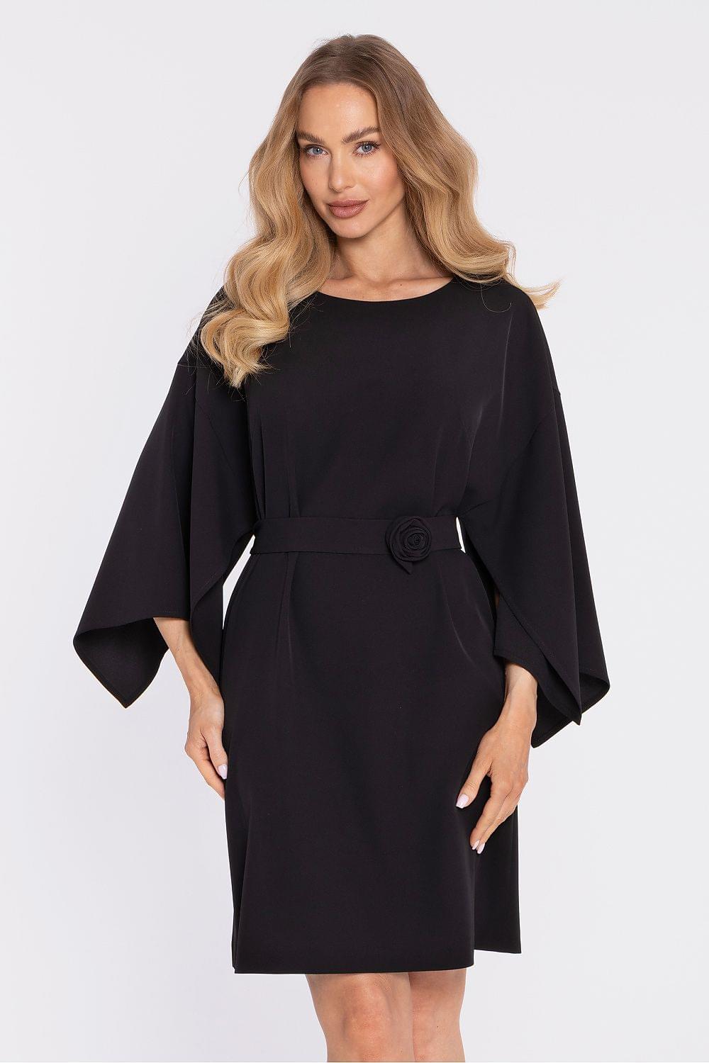 Black cocktail dress with cape sleeves and belt at the waist with rose appliqué