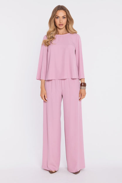 Pink blouse with long bell sleeves and round neck; matching straight wide-leg pants.