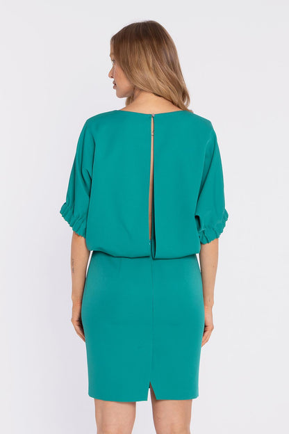 Teal daydress from back view with center back slit and half-length puff sleeves.