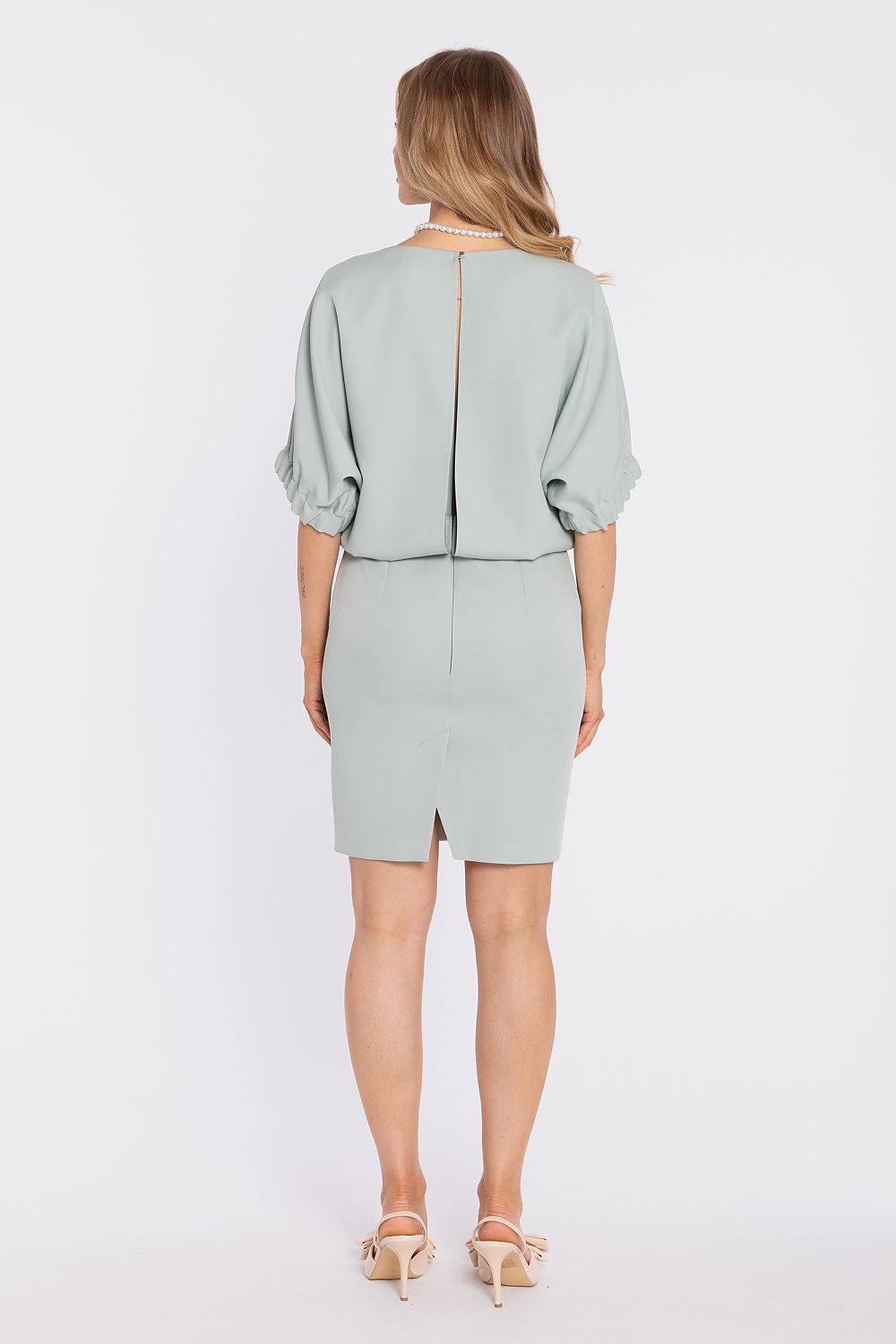 Sage daydress back view with center seam opening and knee-length straight skirt.