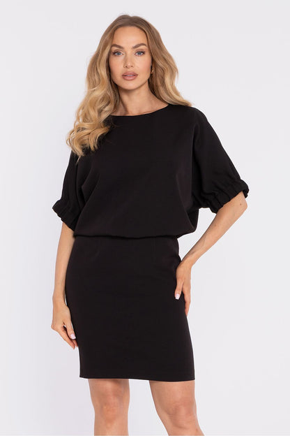 Black daydress with puff sleeves, elastic waist detail, and straight knee-length skirt