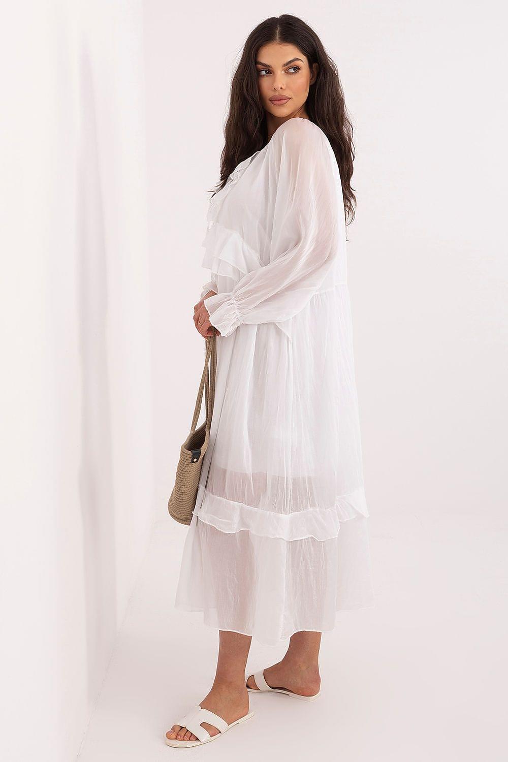White tiered daydress with long sleeves and ruffled hem