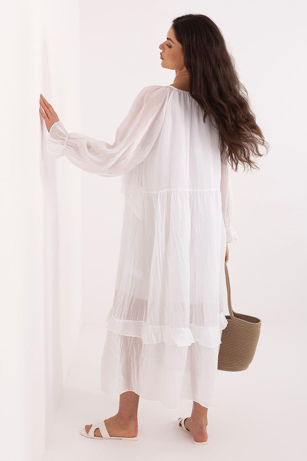 White tiered daydress with long sleeves and layered ruffle hem, back view