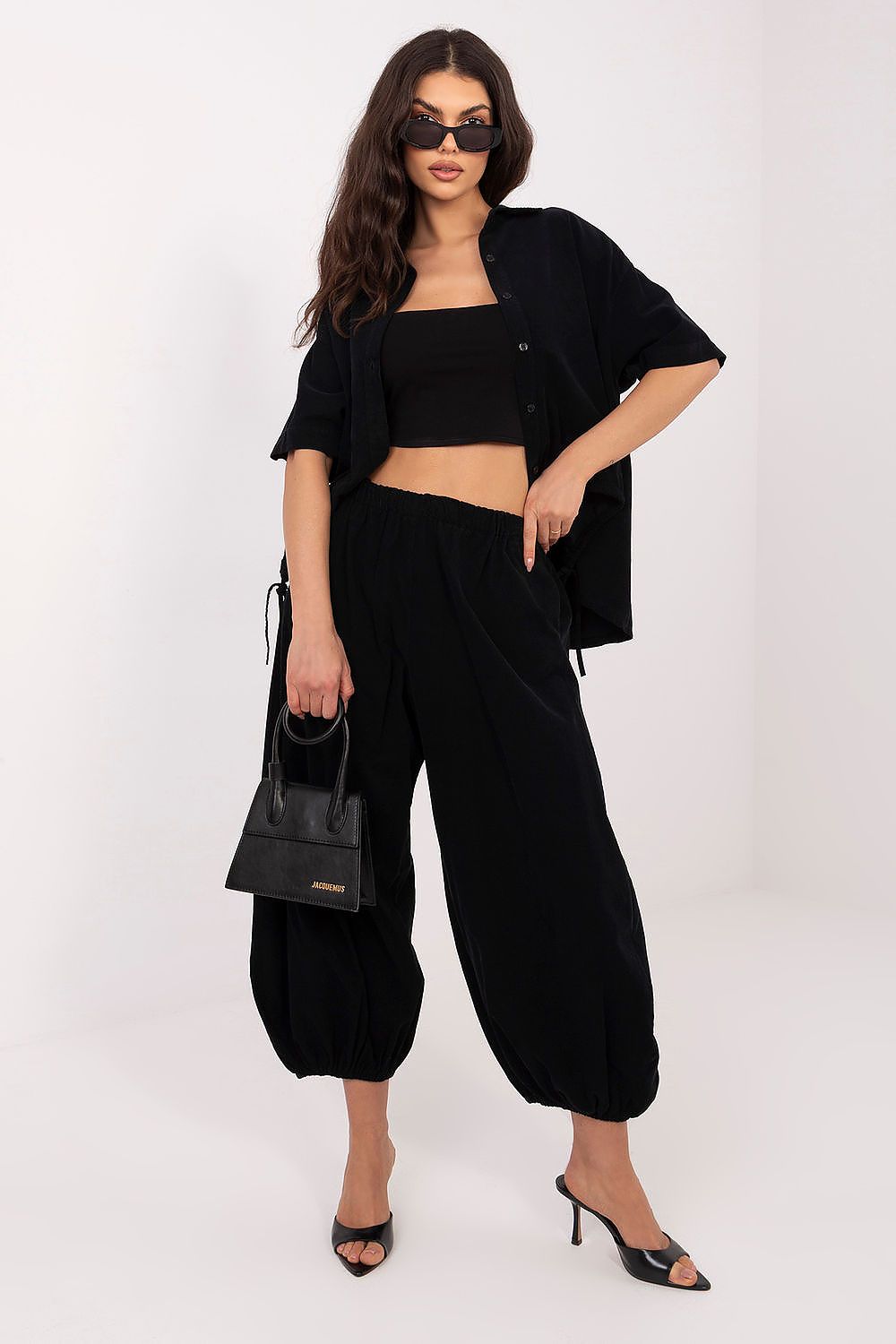 Black short-sleeve button-up shirt with front buttons and pointed collar
