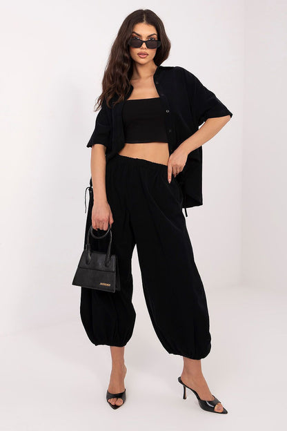 Black short-sleeve button-up shirt with front buttons and pointed collar