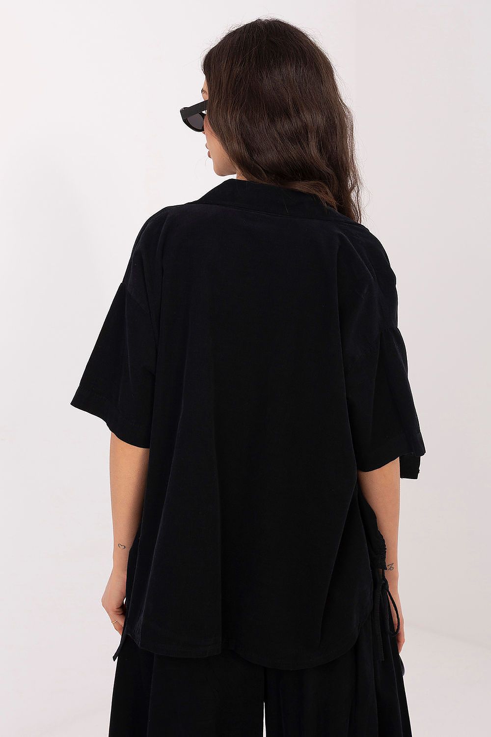 Black short-sleeve button-up shirt, back view with yoke and drape