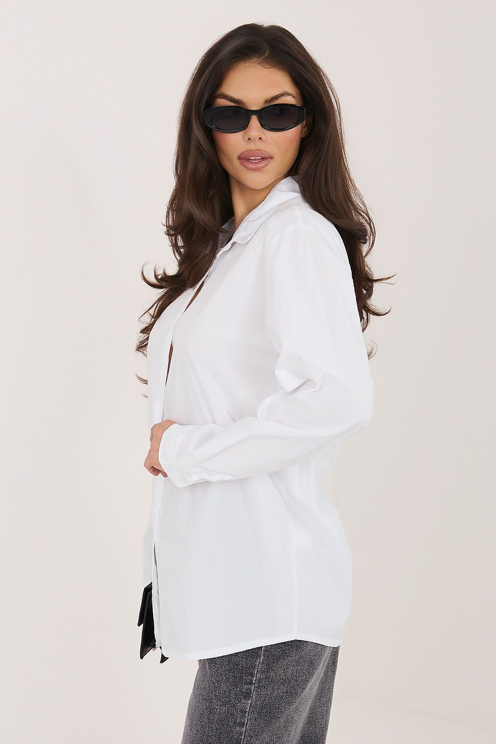 White long-sleeve button-up shirt with pointed collar and buttons down the front