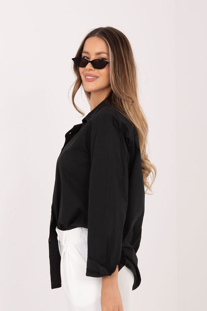 Black long-sleeve shirt with button front and pointed collar, side view