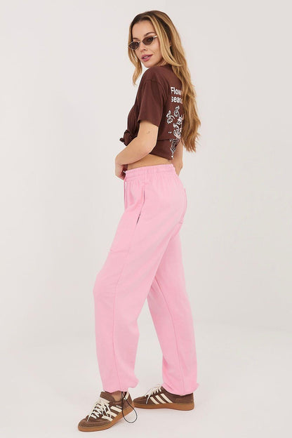 Pink track trousers, loose fit with drawstring waist and tapered ankle hem