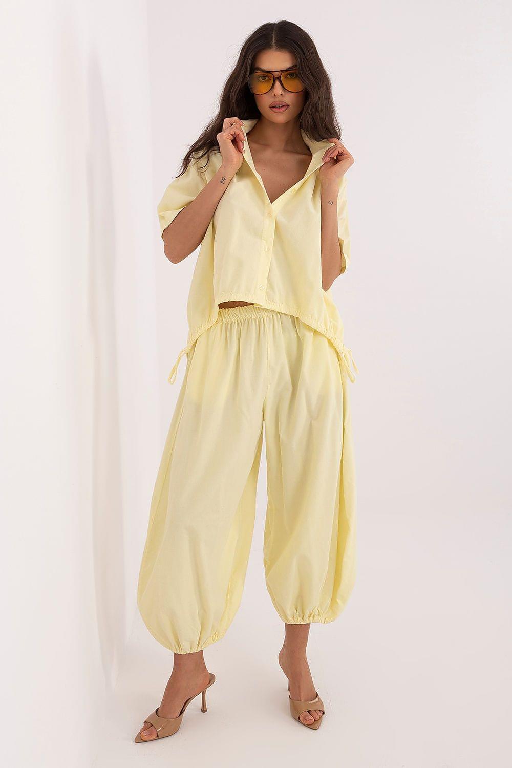 Yellow wide leg trousers with elastic waistband and gathered ankle cuffs