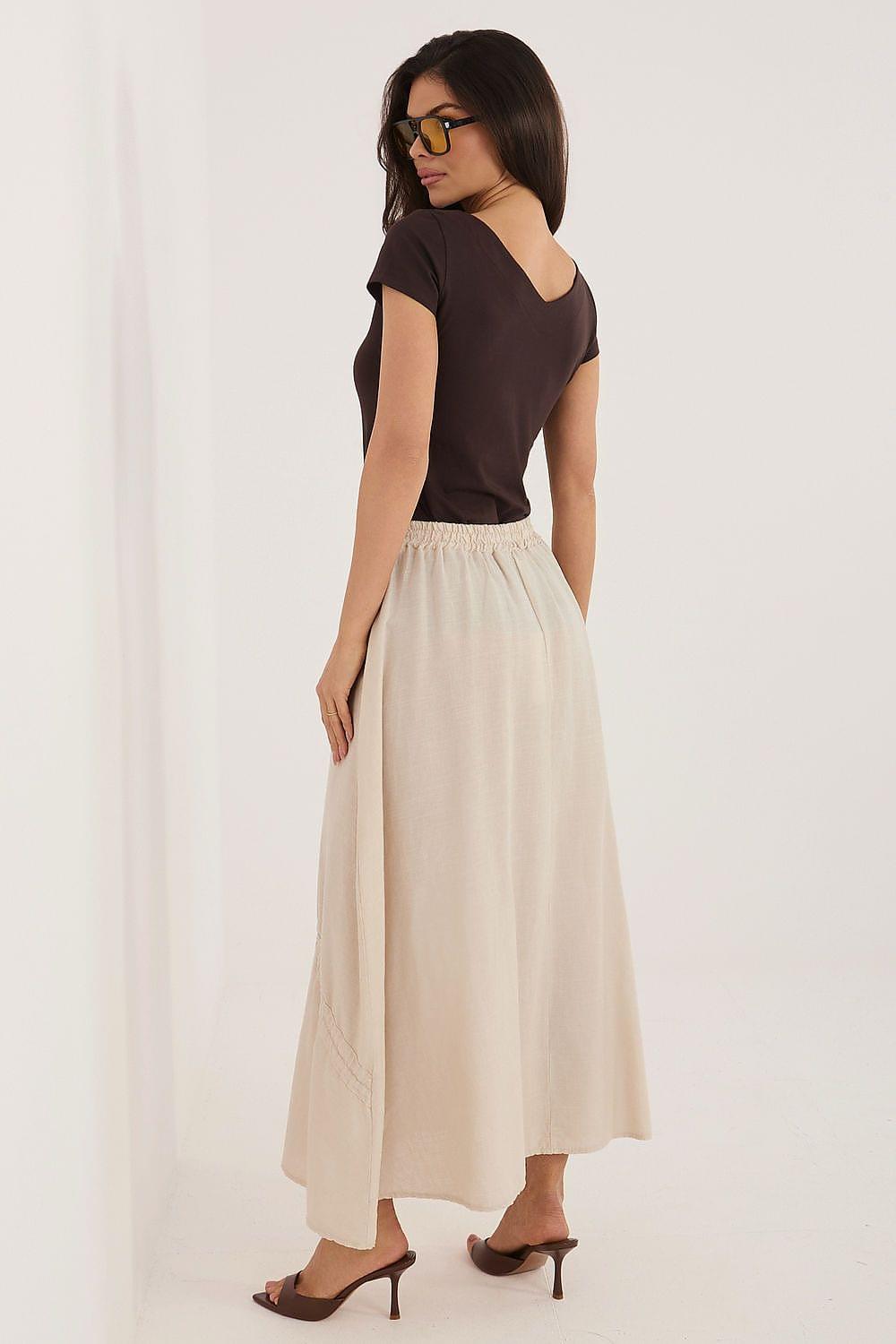 Light beige long skirt with elastic waist and tassel drawstring ties, side view