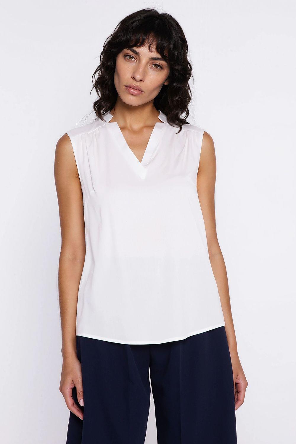 White sleeveless V-neck blouse with loose draped fit