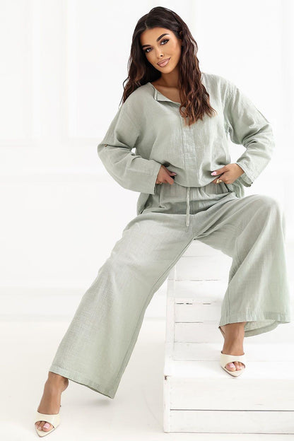 Women’s sage green wide-leg trousers with front seam details and relaxed drape