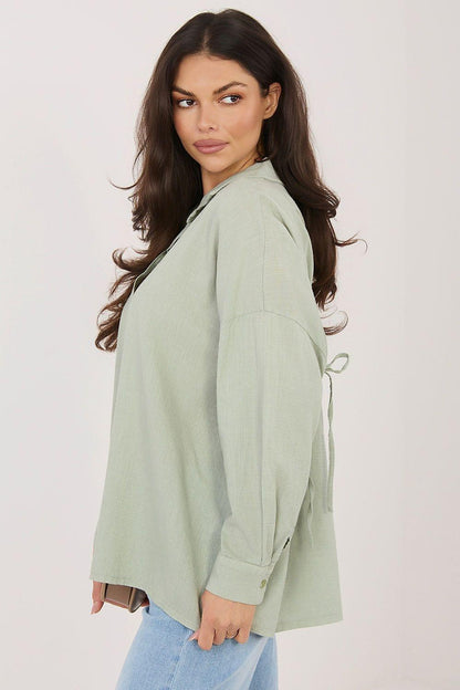 Sage green long sleeve shirt, side view with button front and drawstring hem ties