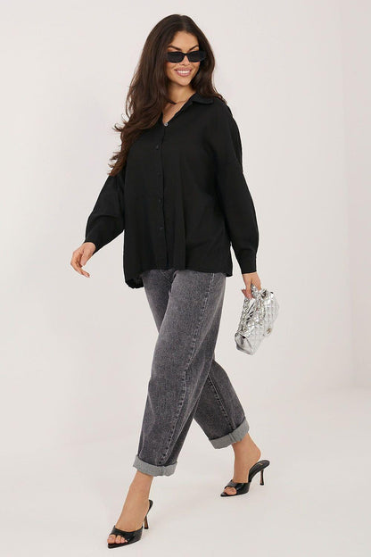 Black long sleeve shirt with front buttons and relaxed fit, full body view