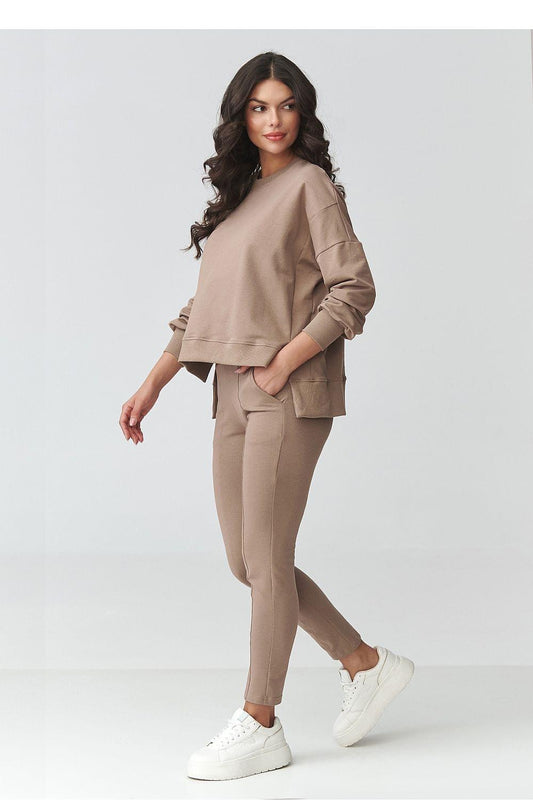 Taupe pullover sweatshirt paired with slim jogger pants with cuffed hems
