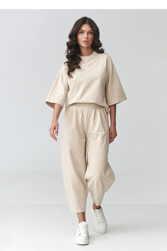 Beige two-piece set with loose short-sleeve top and wide cropped pants