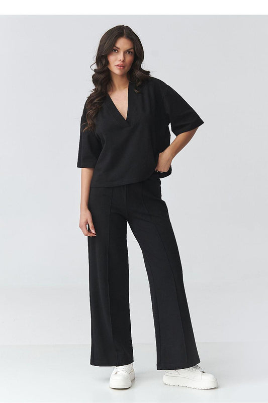 Black V-neck top and wide-leg pants set, side view